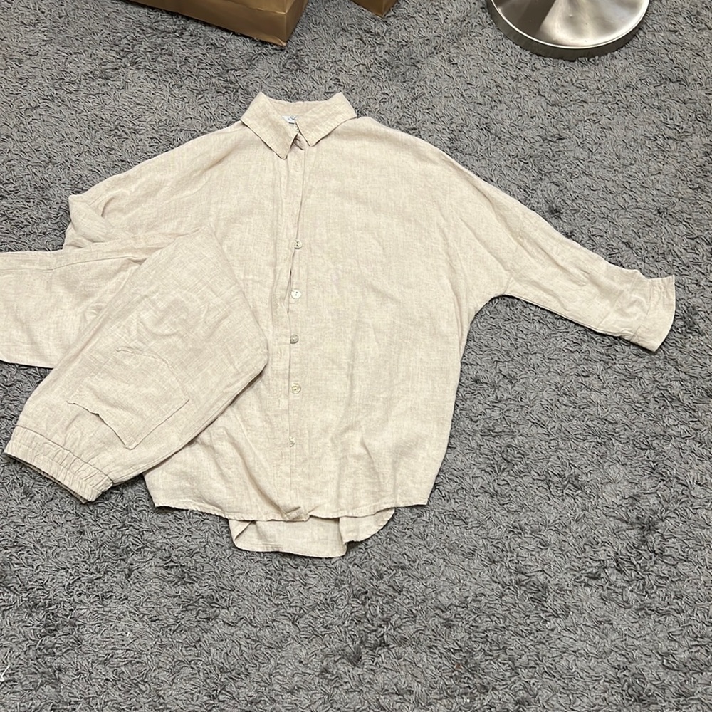 the suit is beige.  cotton and linen material.